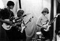 Grupė "Reurgs Ribs" (vėliau "Dobilas") su savadarbėmis gitaromis 16-oje vidurinėje mokykloje, Naujametinis karnavalas, 1966–1967 m.: N. Ramanauskas, S. Gaidulis, E. Urbonas (iš asmeninio E. Urbono archyvo)