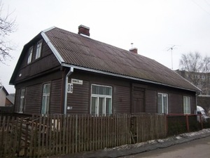 A house with semi-hip two-pitched roof